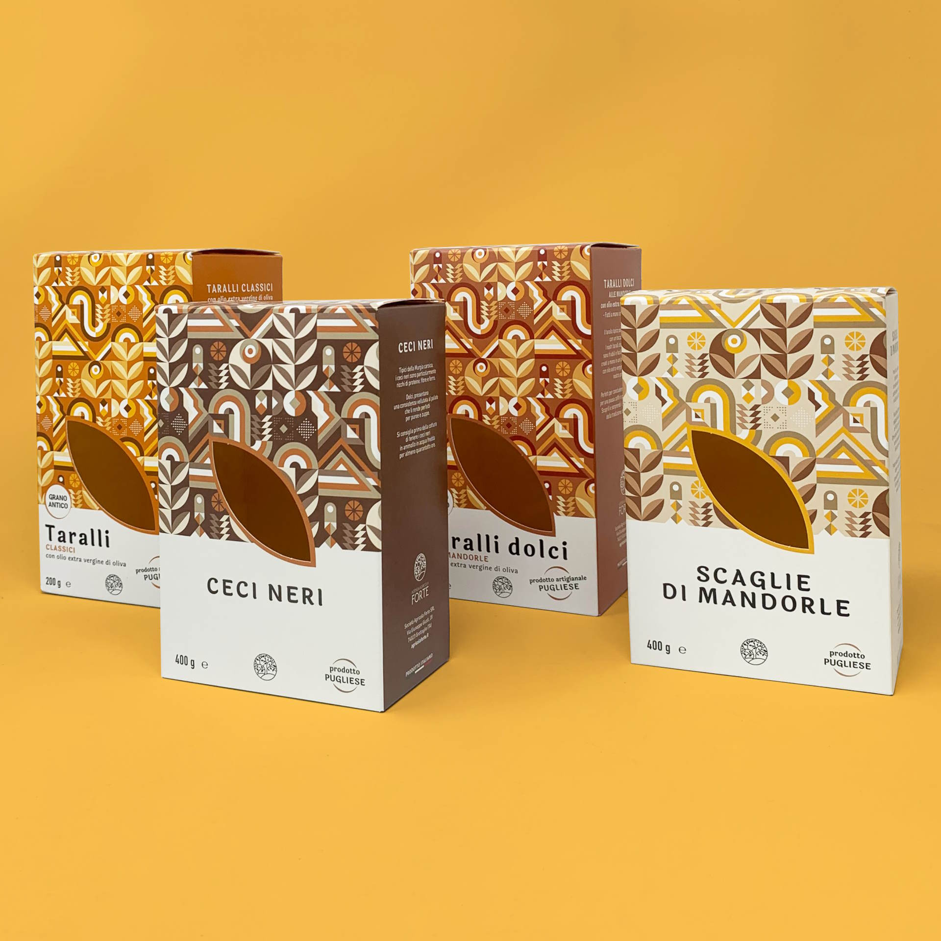 Esempio di astucci in cartoncino Royal Box per prodotti alimentari (taralli, ceci, mandorle) con stampa offset personalizzata, finitura laccata e finestra fustellata a forma di foglia